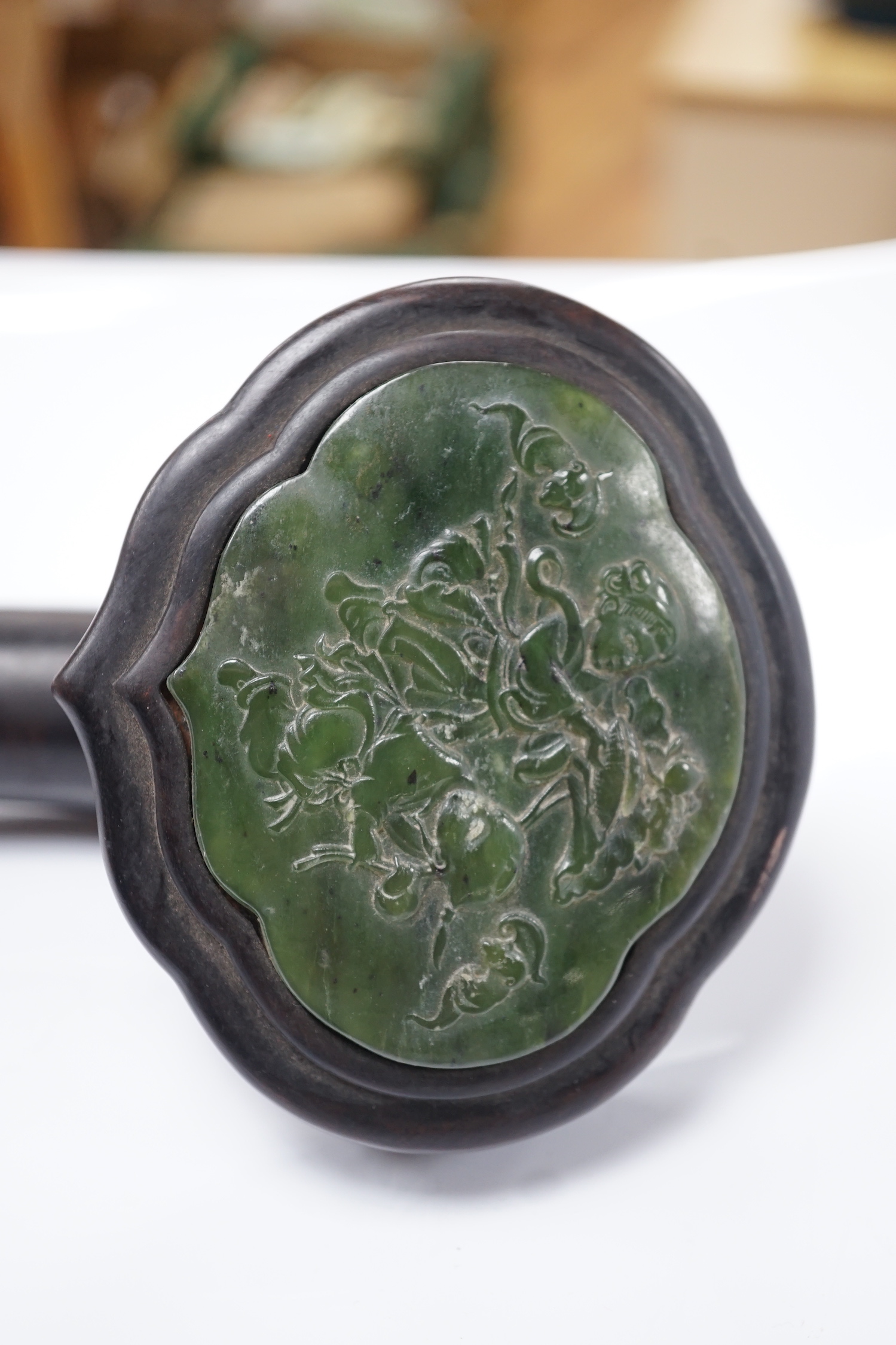 A Chinese spinach green jade inset hardwood ruyi sceptre, 51cm